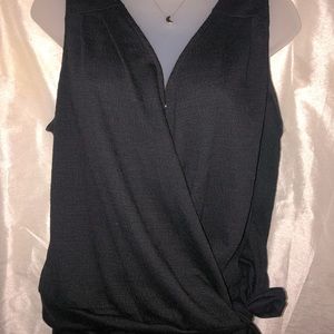 Black top that opens across with one button at the top.
